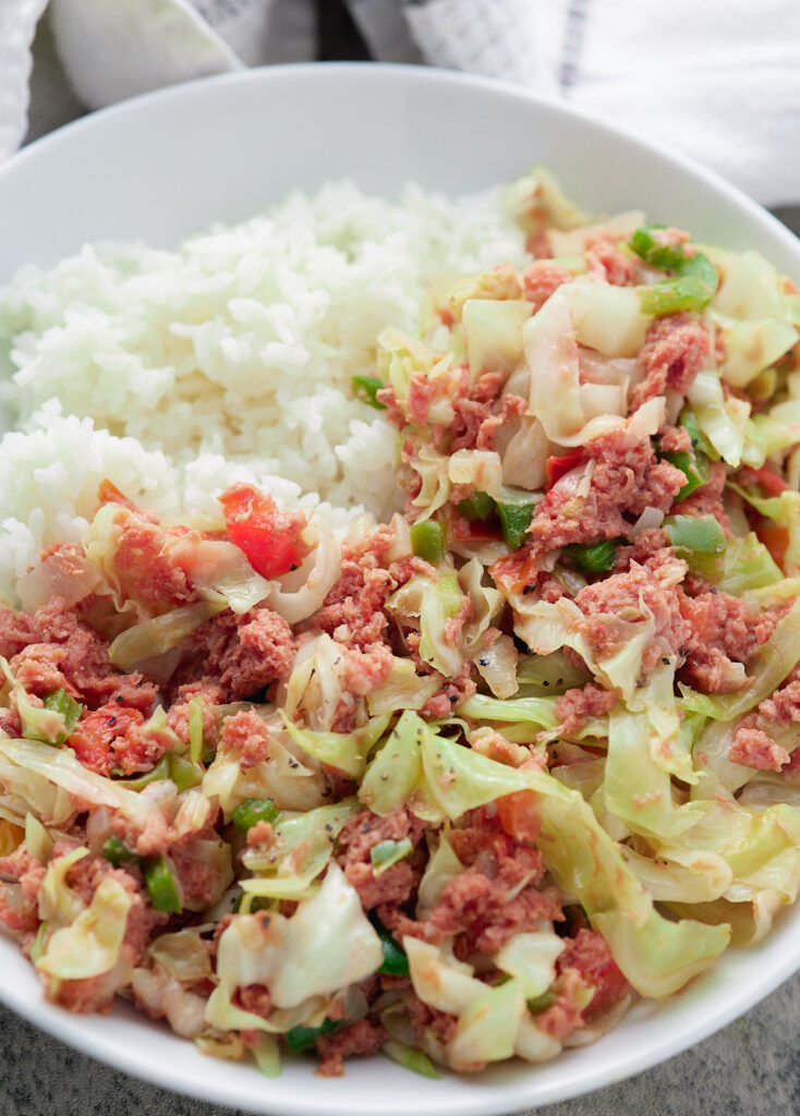"Jamaican corned beef and white rice with cabbage"