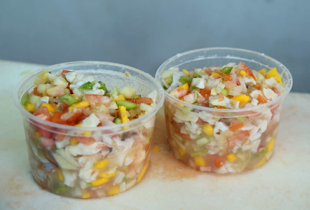 "Bahamian Tropical Conch Salad on a white background"