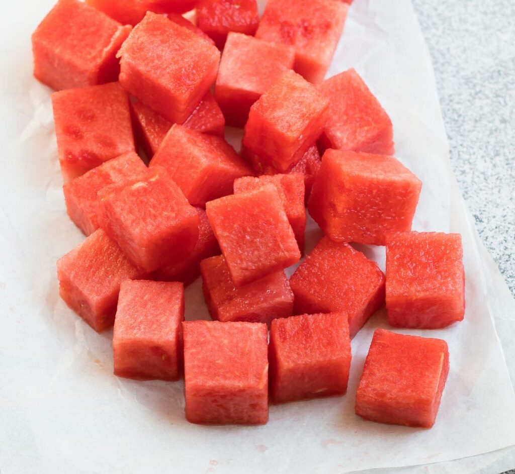 "watermelon cubes on a white plate"