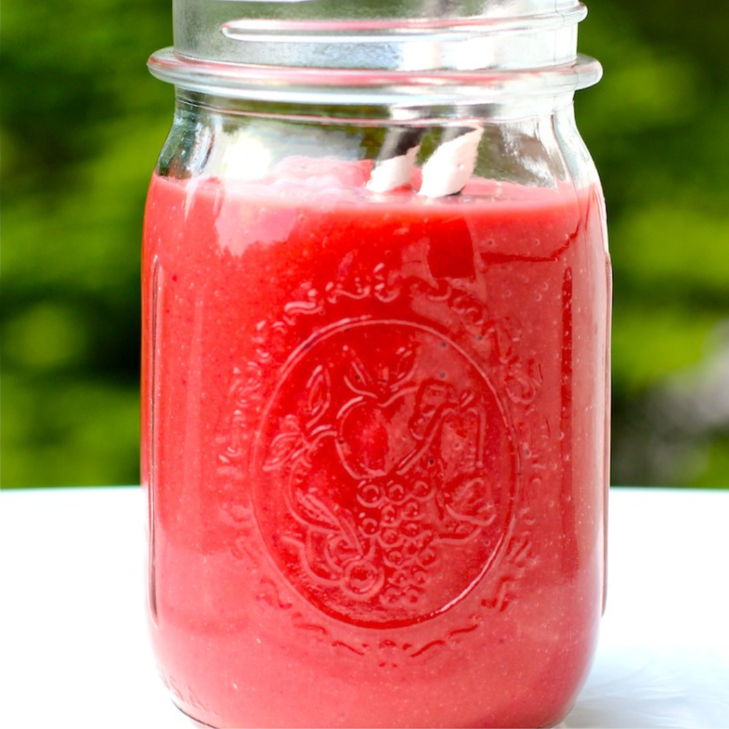 "Avocado and beet smoothie in a glass jar"