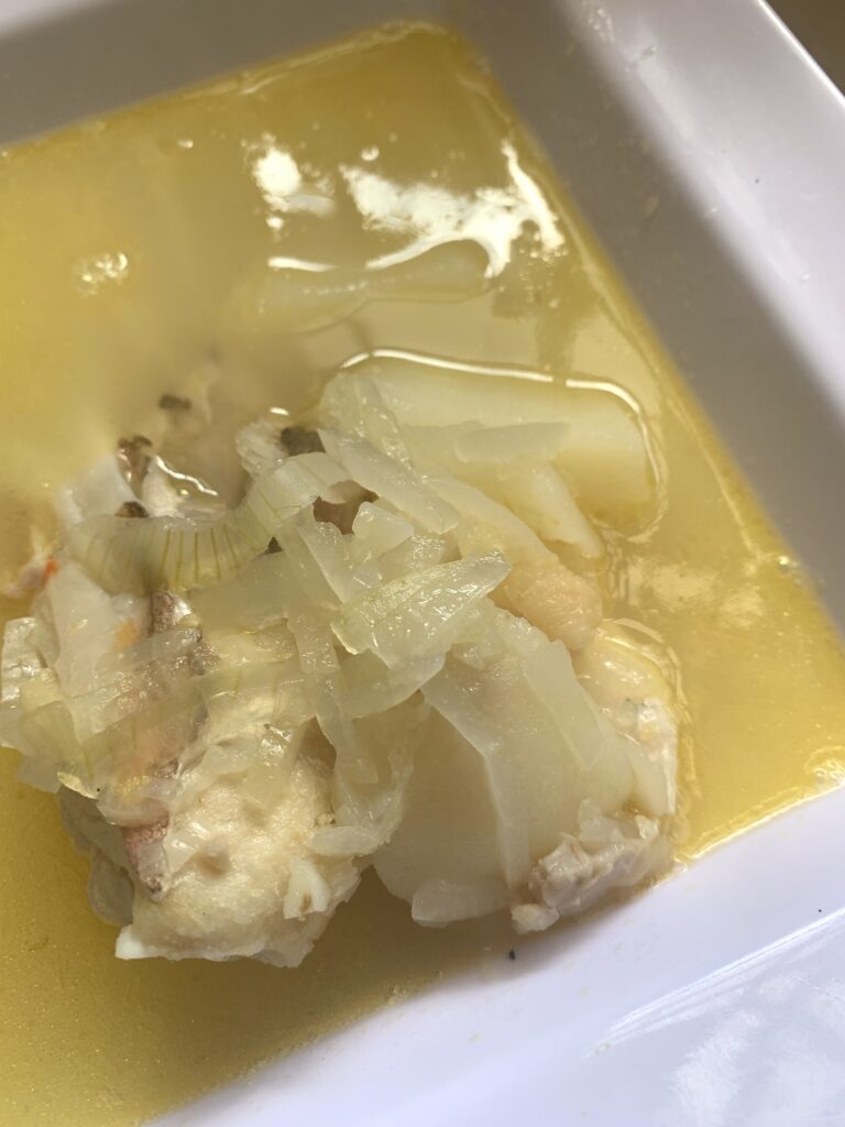 "Nassau grouper in broth with onions and potatoes"