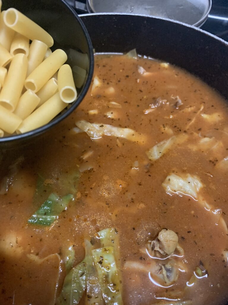 "Adding macaroni to a boiling soup pot"