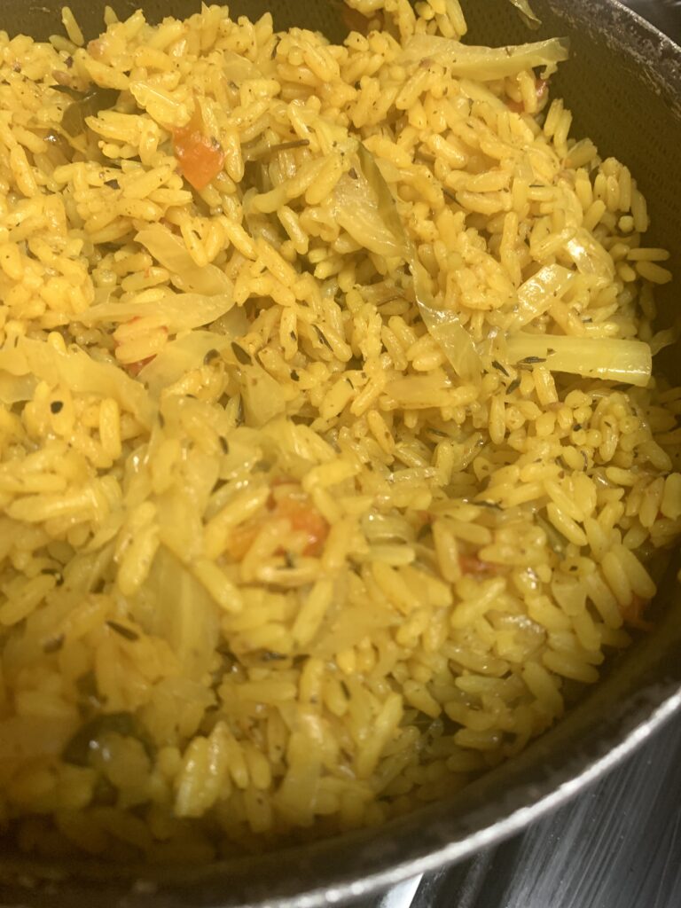 "Fluffy yellow rice with cabbage, herbs and spices"