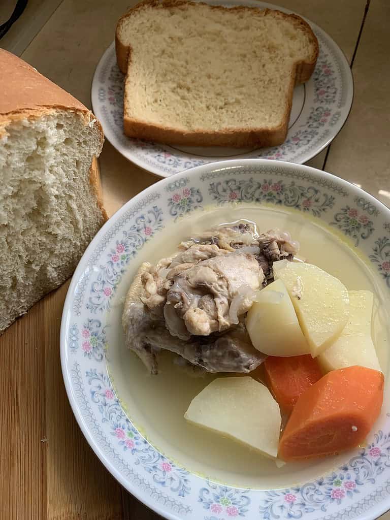 Chicken in a limey broth with carrots, potatoes and homemade coconut bread