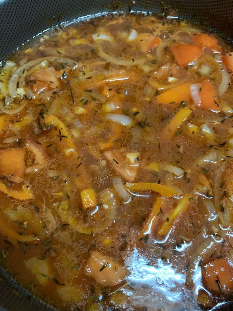 Tomato base gravy with onion, bell peppers and tomatoes