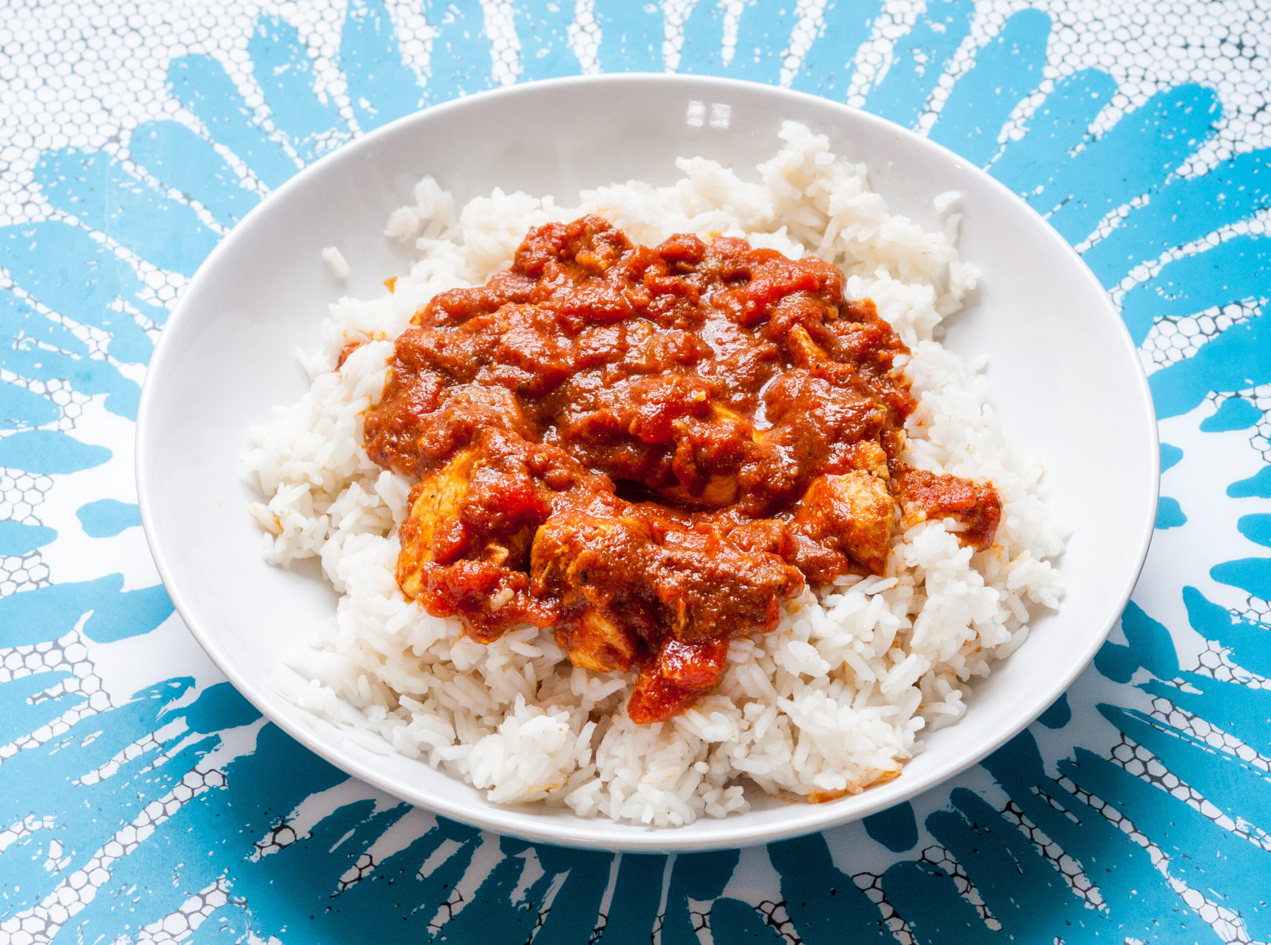"Bahamian Corned Beef and White Rice on a blue and white background"