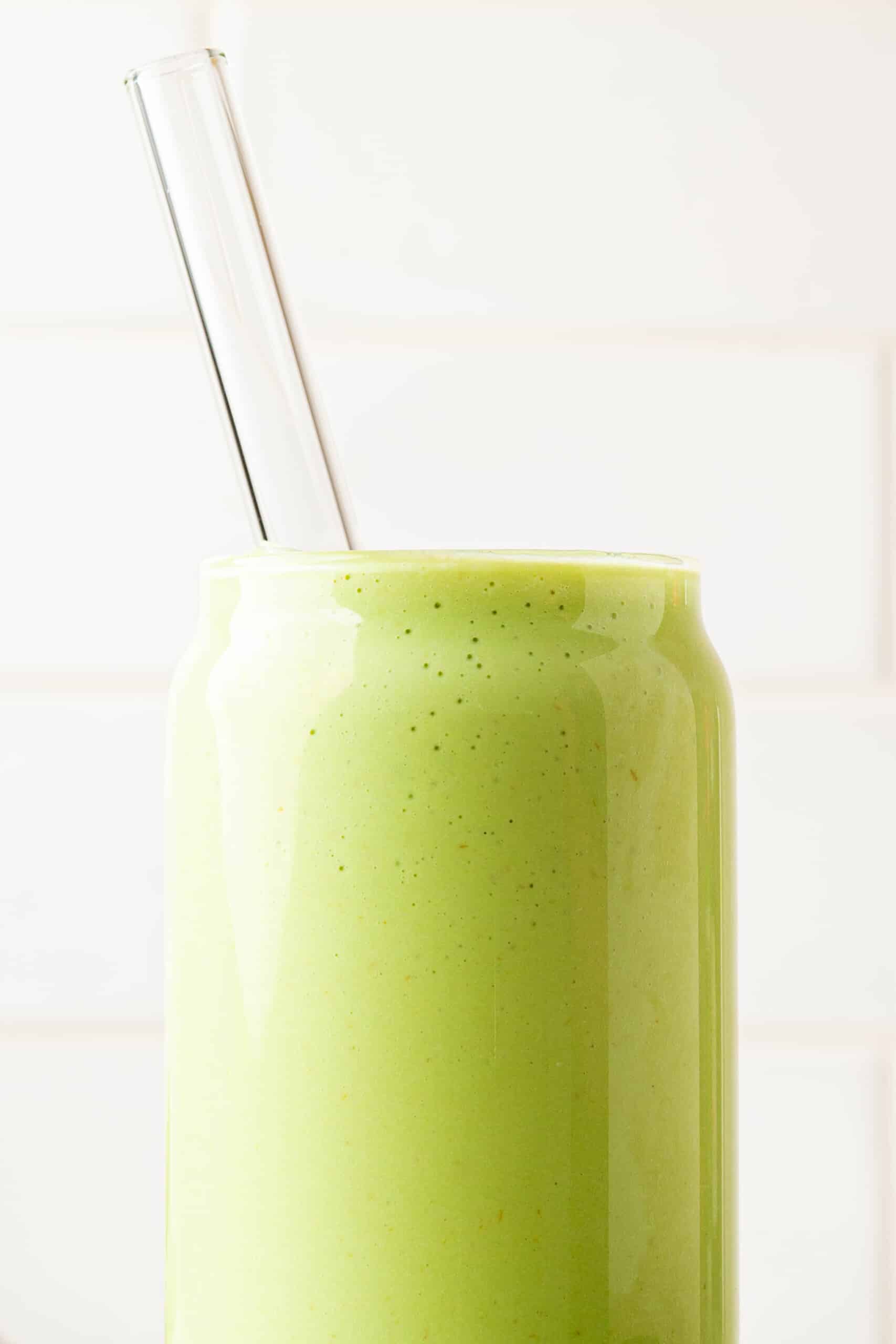 "Avocados in smoothies in a clear glass with a clear straw"