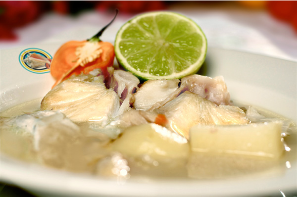 "boiled Nassau Grouper in a zesty, spicy broth with goat pepper and lime on the side"
